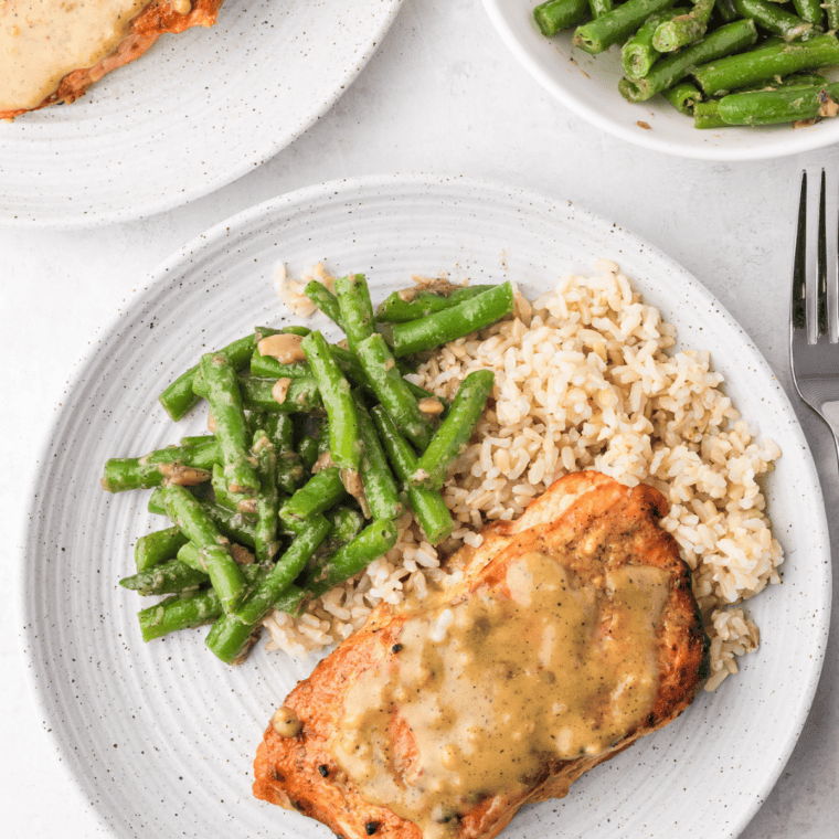 Miso-Ginger — Miso-ginger salmon fillet with a lacquered finish next to sautéed greens