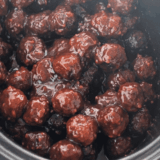 Crockpot Jack Daniel's meatballs cooked in sticky whiskey BBQ sauce in the slow cooker