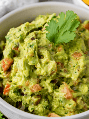 Ripe Hass avocados being mashed for an easy UK guacamole recipe
