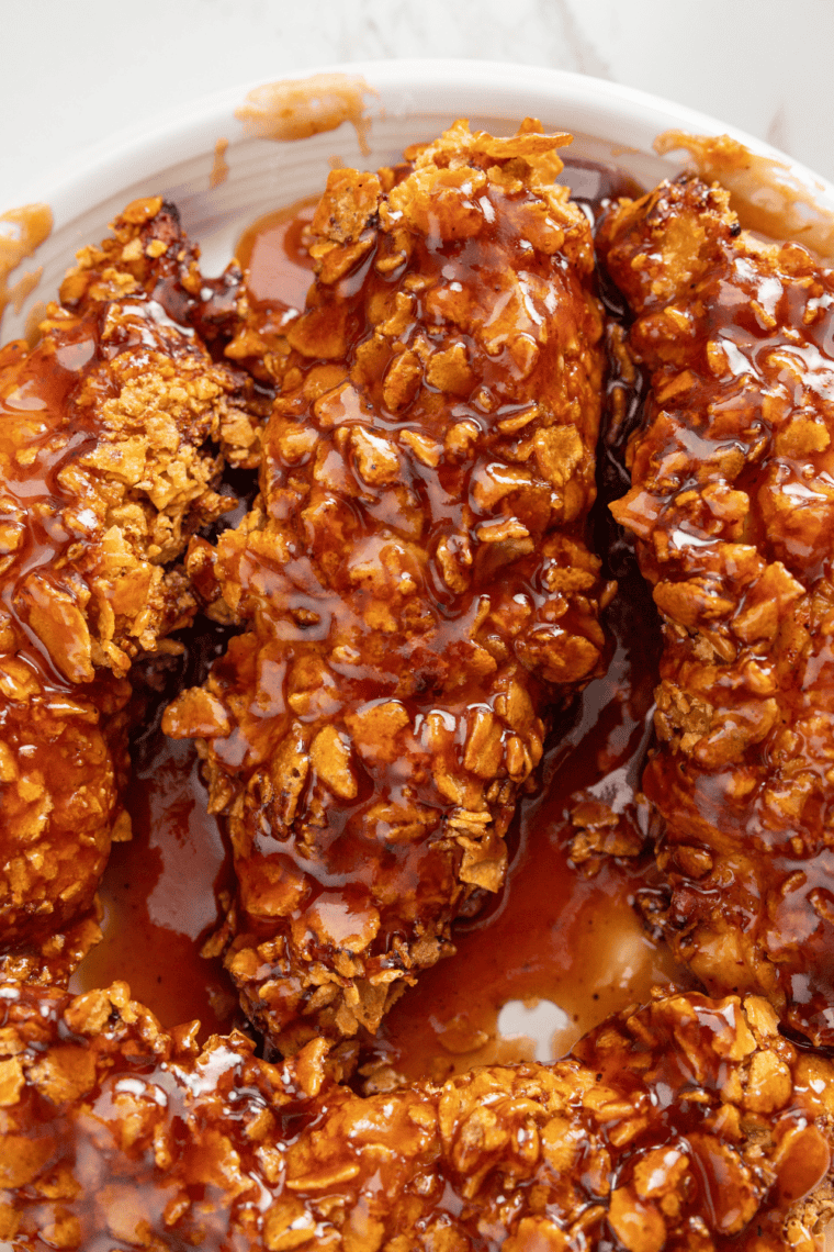 Bowl of Jack Daniel's sauce next to chicken nuggets for dipping