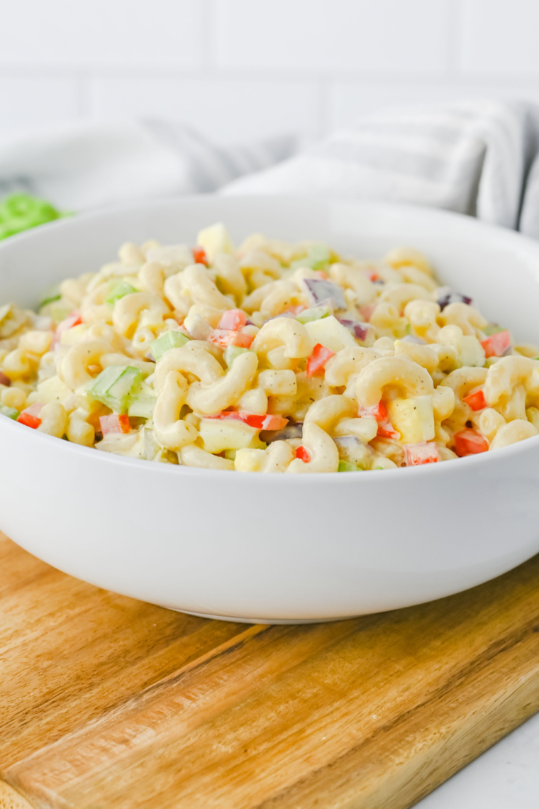 Cottage cheese pasta salad served beside a container of full-fat cottage cheese