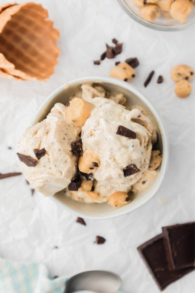 Bowl of thick, creamy Ninja Creami chocolate chip cookie dough blizzard topped with chocolate chips