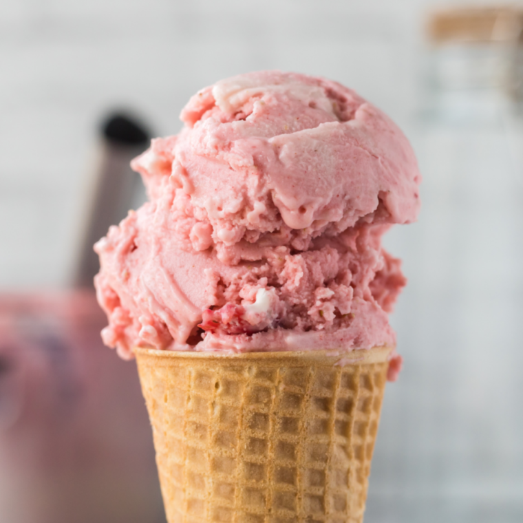 Two scoops of copycat Blue Bell Strawberry ice cream in a bowl, made in the Ninja Creami