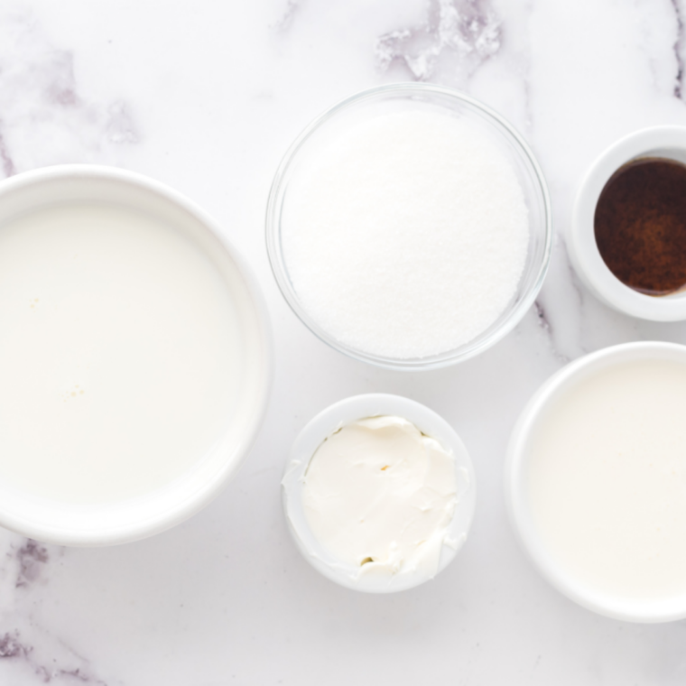 Ingredients for Ninja Creami pistachio ice cream: milk, heavy cream, sweetened condensed milk, pistachio pudding mix, almond extract, and pistachios