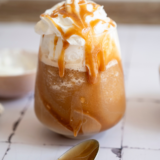 Ingredients for a Ninja Slushi mocha frappe: cold brew, milk, chocolate syrup, simple syrup, and vanilla