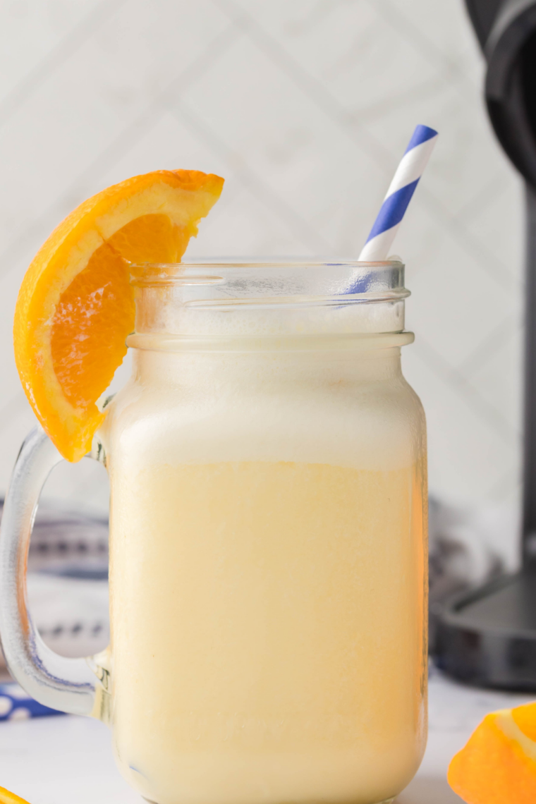 Easy Ninja Slushi Orange Julius recipe pin with a creamy orange frozen drink and recipe title text