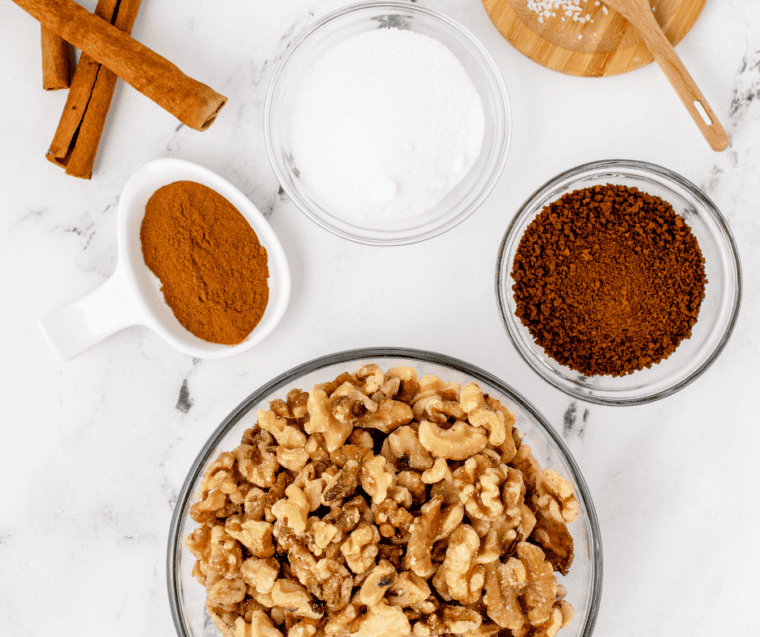 Ingredients for air fryer candied coffee walnuts: raw walnuts, granulated sugar, instant coffee, cinnamon, and kosher salt