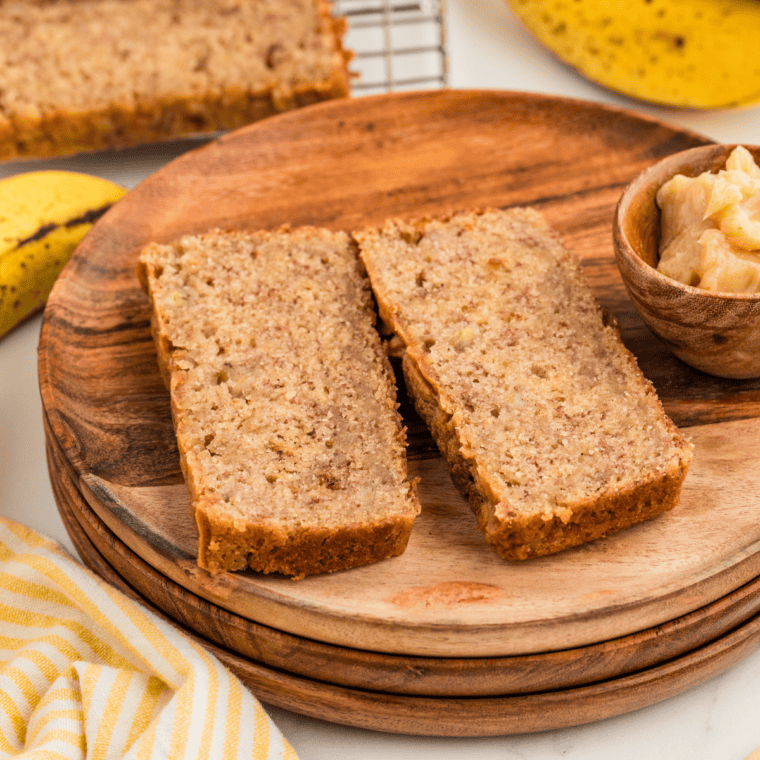 Loaf of Bob Evans banana bread cut into slices with the end piece leaning against it