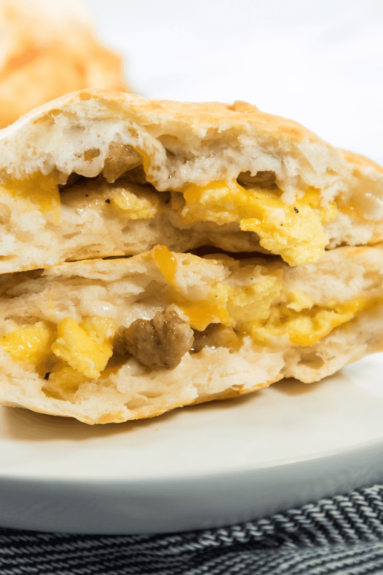 Eight Bob Evans copycat breakfast sausage patties browning in a cast iron skillet