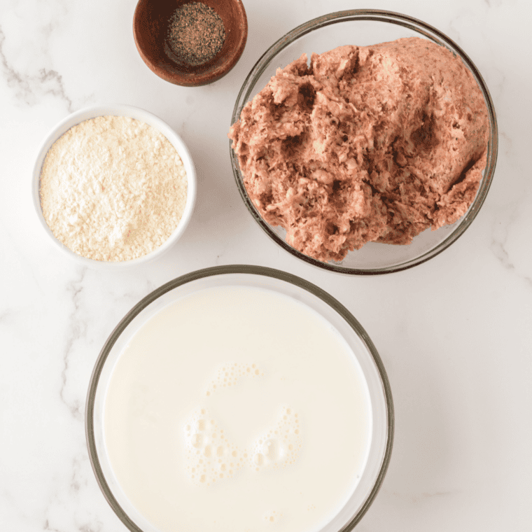Ingredients for Bob Evans sausage gravy recipe: pork sausage roll, flour, whole milk, black pepper, and salt