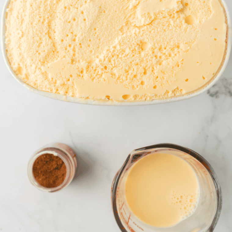 Ingredients for a copycat Chick-fil-A Autumn Spice Milkshake: vanilla ice cream, milk, brown sugar, cinnamon, nutmeg, and Biscoff cookies