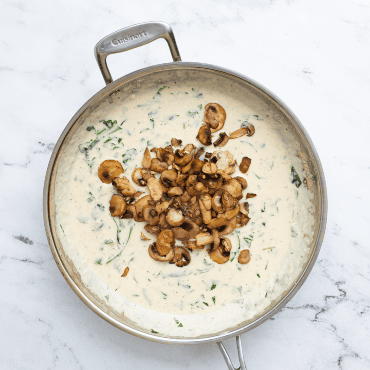 Cream and parmesan stirred into the mushroom sauce until it coats a spoon