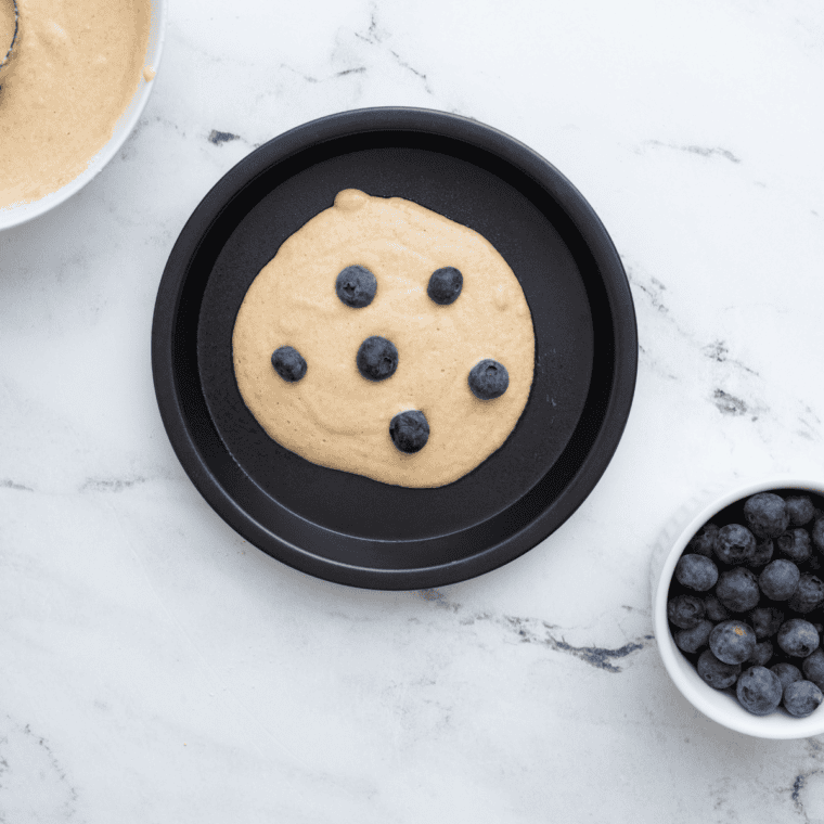 Rested hotcake batter in a bowl with bubbles rising to the surface