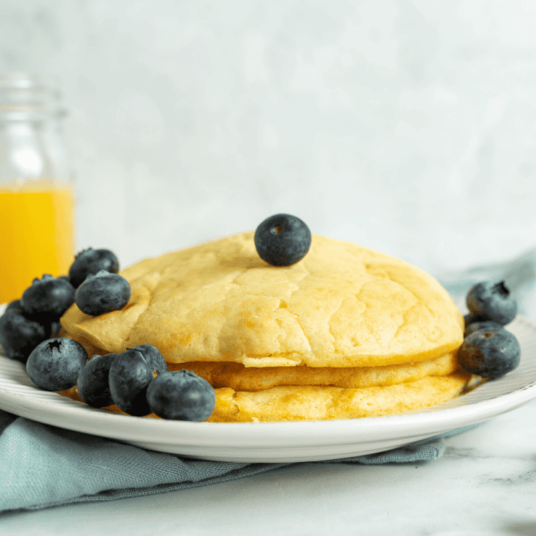 Wide golden hotcake with crisp lacy edges on a plate