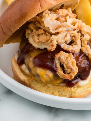 Air Fryer Copycat French's Fried Onions are crispy, golden, and unbelievably easy — no pot of hot oil required. These homemade fried onions soak in buttermilk, get dredged in seasoned flour, and crisp up in the air fryer in about 10 minutes. They taste better than anything from a can, and they cost a fraction of the price.