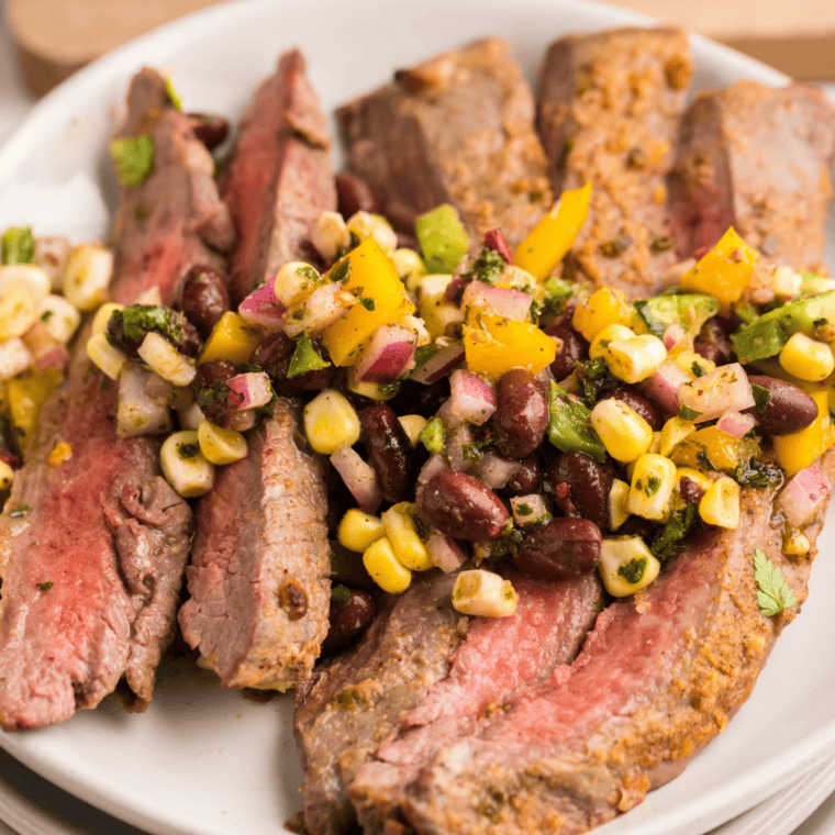 Grilled steak on a plate seasoned with homemade buttery garlic and herb blend