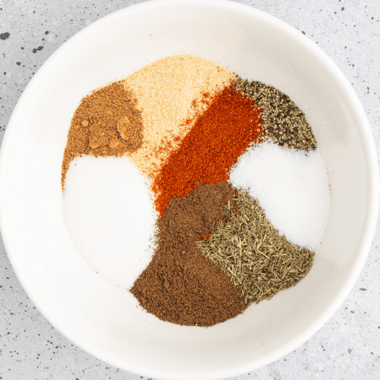 Dried lemon zest, coarse black pepper, kosher salt, garlic, and citric acid in small bowls