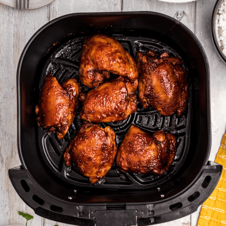 Air fryer chicken thighs with charred, caramelized edges from homemade baja chipotle marinade