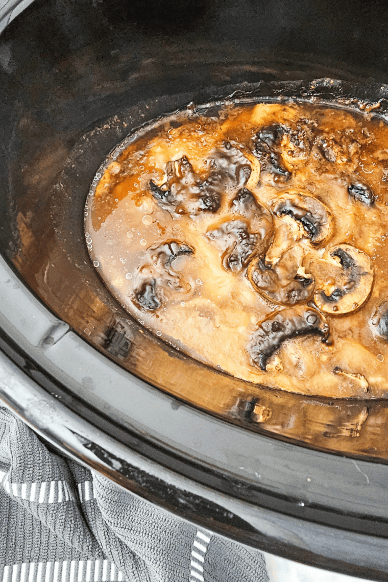 Tender slow cooker pork chops with gravy, ready to serve