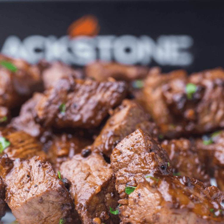 Bowl of seared steak bites seasoned with copycat Ruth's Chris blend and topped with parsley