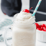 Thick copycat Wendy's Vanilla Frosty in a clear cup with a spoon standing upright in it