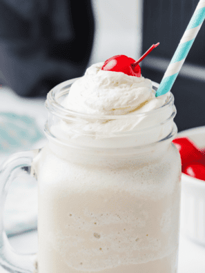 Thick copycat Wendy's Vanilla Frosty in a clear cup with a spoon standing upright in it
