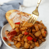 If you have ever ordered a Grand Slam and found yourself eating the potatoes first, this one is for you. Denny's home fries are the seasoned, red-skinned potatoes that show up under their skillets and beside their egg plates: crackly and browned on the outside, soft and almost creamy in the middle, and seasoned with a paprika-forward blend that tints them a warm orange.
