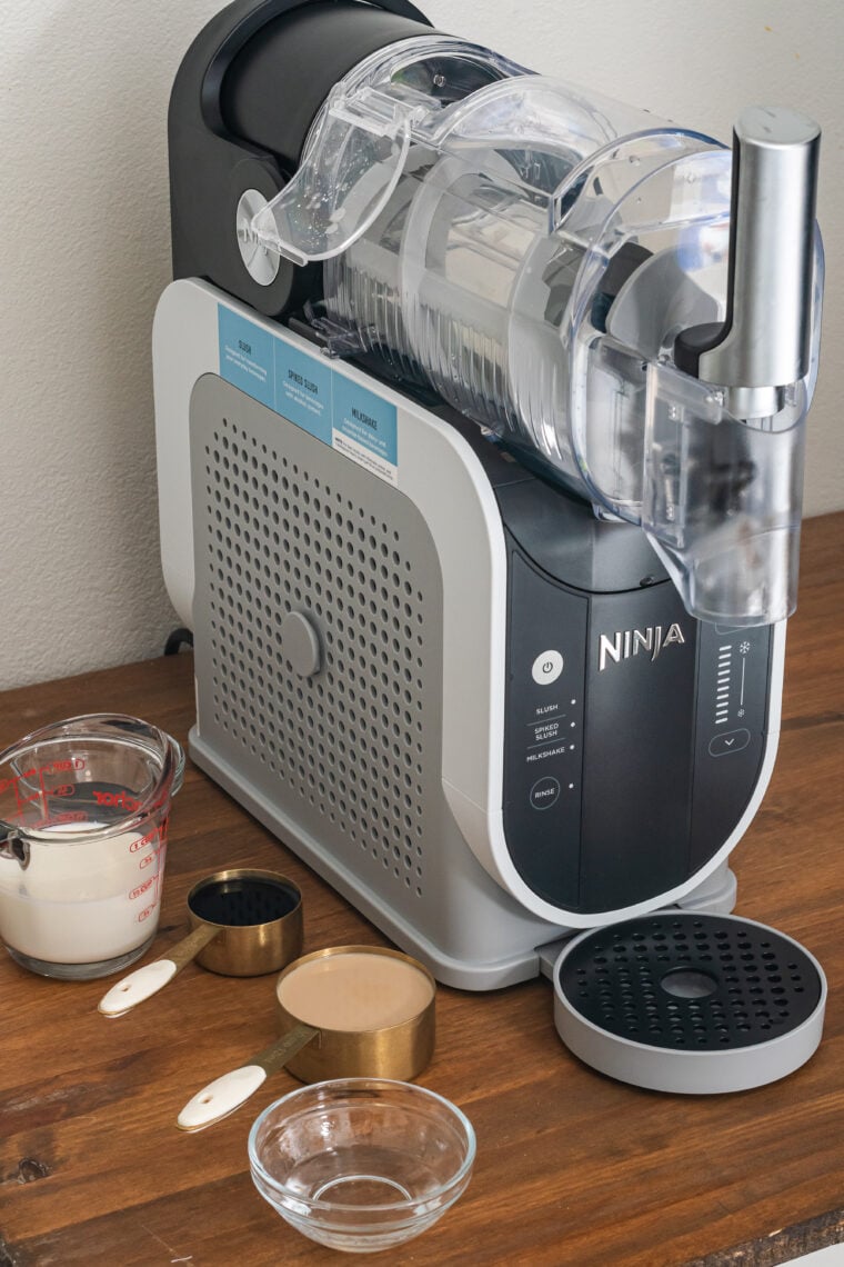 Chilled milk, half-and-half, and liqueur bottles for a Ninja Slushi frozen mudslide
