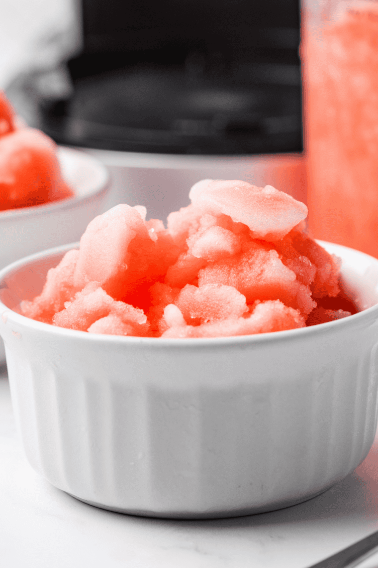 Bright red Italian ice made in the Ninja Creami served in a glass dish &mdash; 70