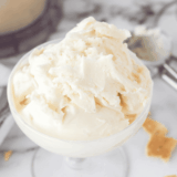 Scoops of Ninja Creami cheesecake ice cream in a glass bowl
