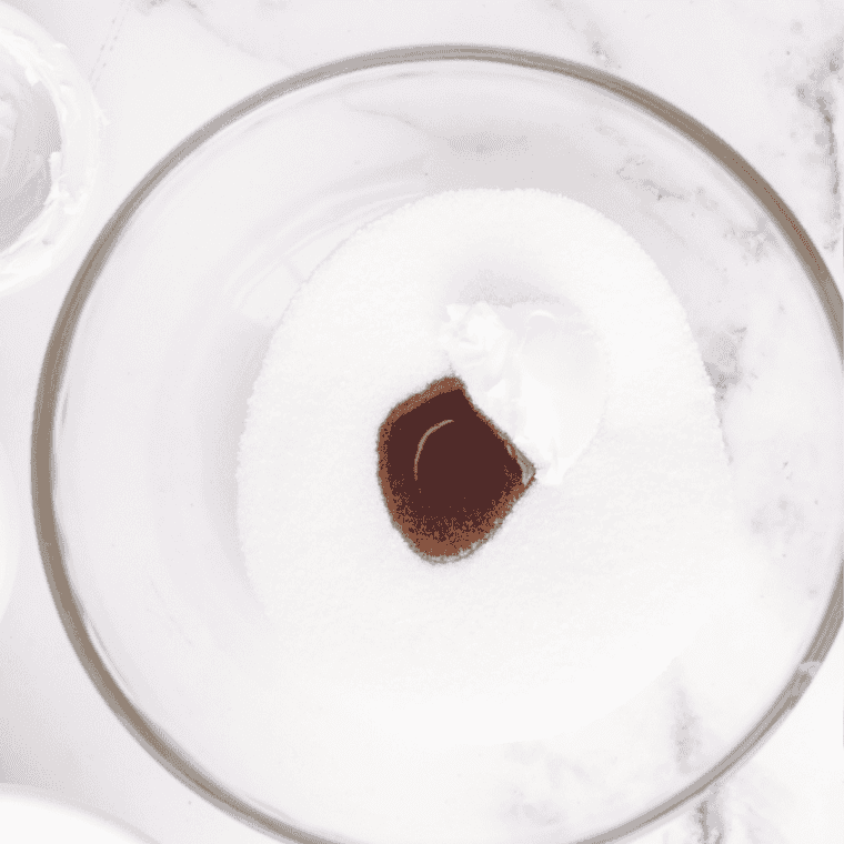 Cream cheese, milk, sugar, and lemon juice blended smooth in a glass bowl