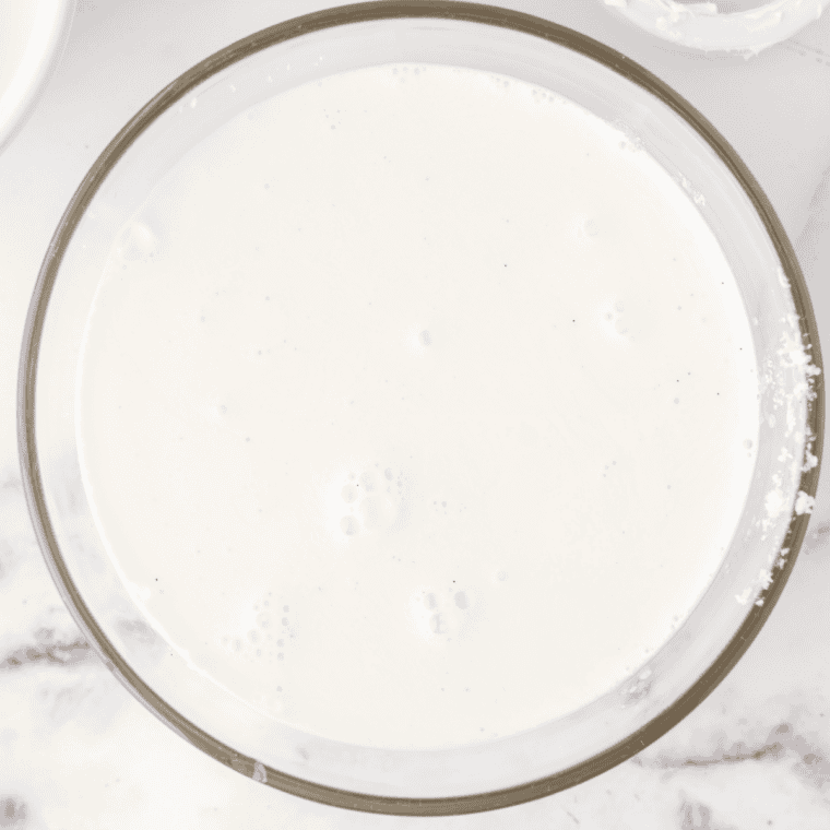 Greek yogurt folded into the smooth cream cheese base with a spatula