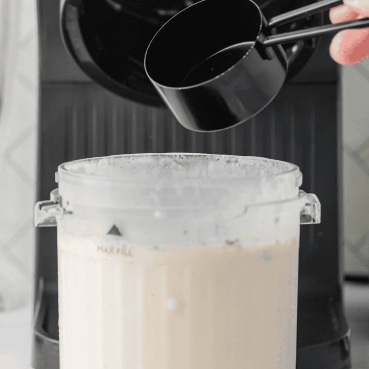 Folding crushed Oreos and graham cracker crumbs into the cheesecake milkshake base