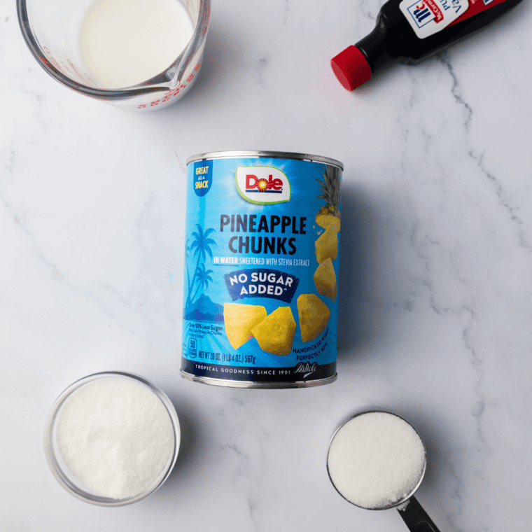Ingredients for Ninja Creami Dole Whip: canned pineapple, milk, vanilla ice cream mix, sugar, and vanilla extract