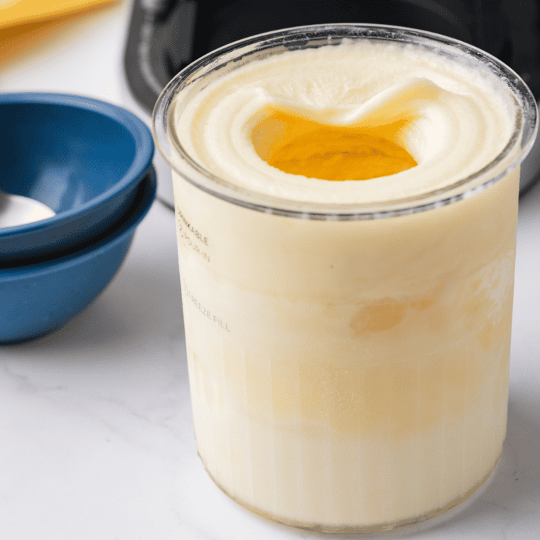 Pineapple Dole Whip piped into a soft-serve swirl in a chilled cup