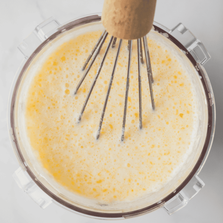 Gooey butter cake ice cream base whisked to a thin, pourable cheesecake batter consistency