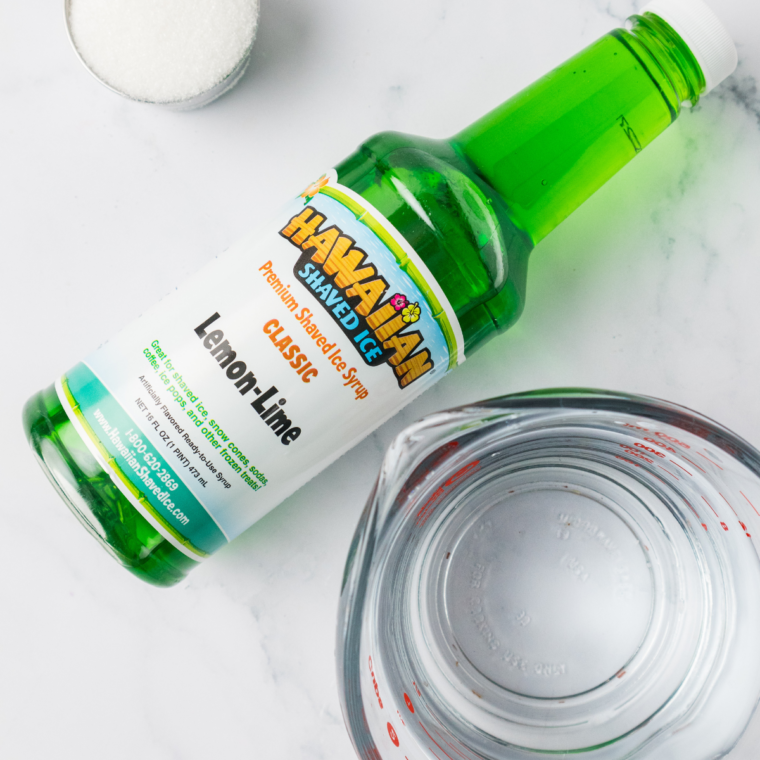 Ingredients for Ninja Creami lime Italian ice: fresh limes, sugar, water, salt, and a zester