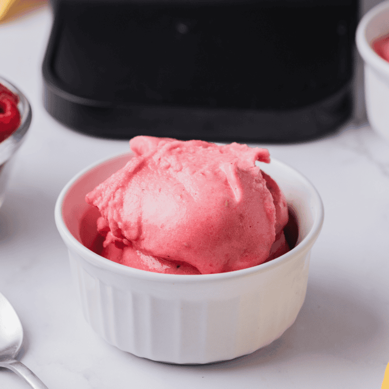 Ninja Creami raspberry lemonade sorbet scooped into a bowl for serving