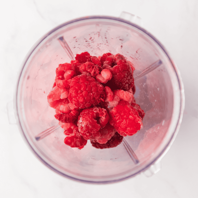Fresh raspberries in a bowl for Ninja Creami raspberry lemonade sorbet