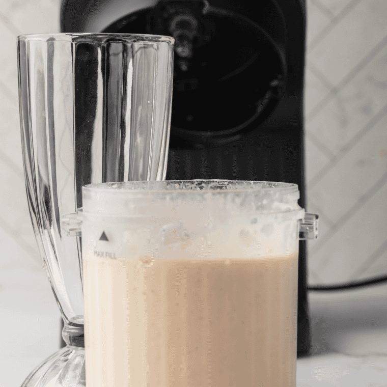 Milk being added to the Ninja Creami pint before running the milkshake cycle
