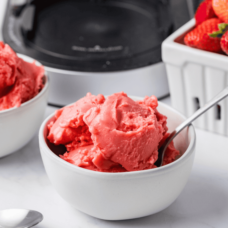 Soft serve texture strawberry Greek yogurt ice cream served in a bowl