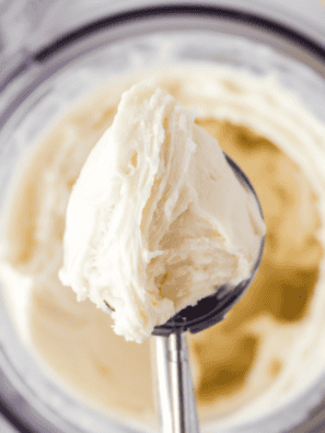 Scoop of Ninja Creami vanilla Greek yogurt ice cream with vanilla bean flecks