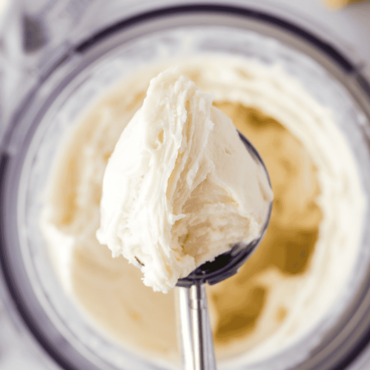 Scoop of Ninja Creami vanilla Greek yogurt ice cream with vanilla bean flecks