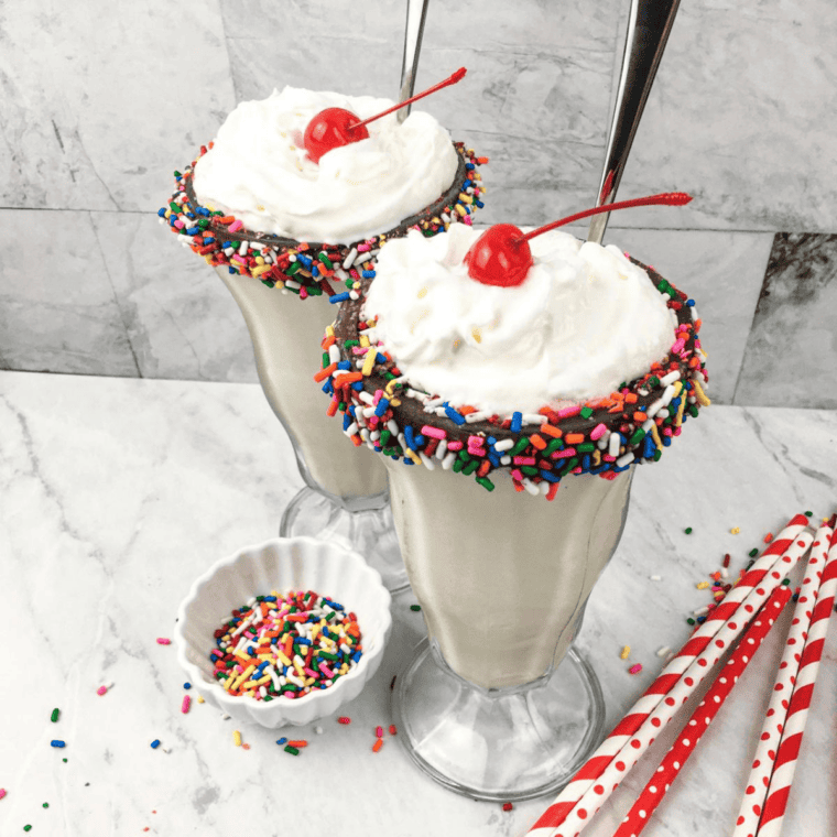 Thick chocolate milkshake made in the Ninja Creami, served in a tall glass