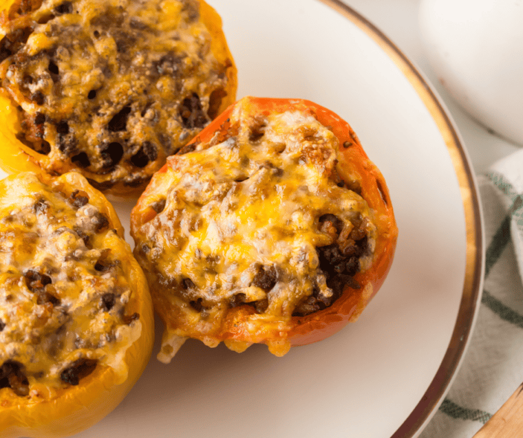 Ninja Crispi stuffed peppers topped with bubbling Colby Jack cheese and golden-brown spots