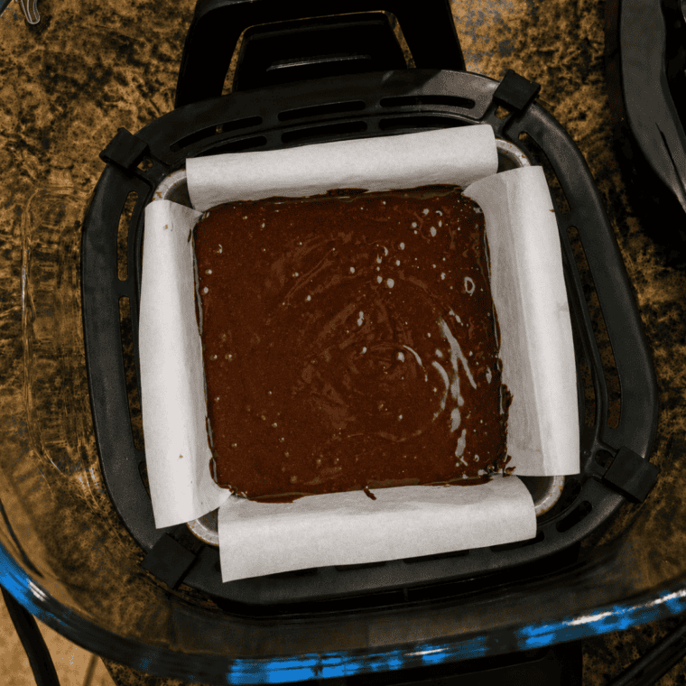 Pan of brownies baked in the Ninja Crispi glass container, cut into squares