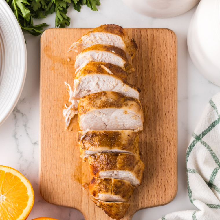Quarter-inch slices of Ninja Crispi turkey breast fanned out with crisp golden skin