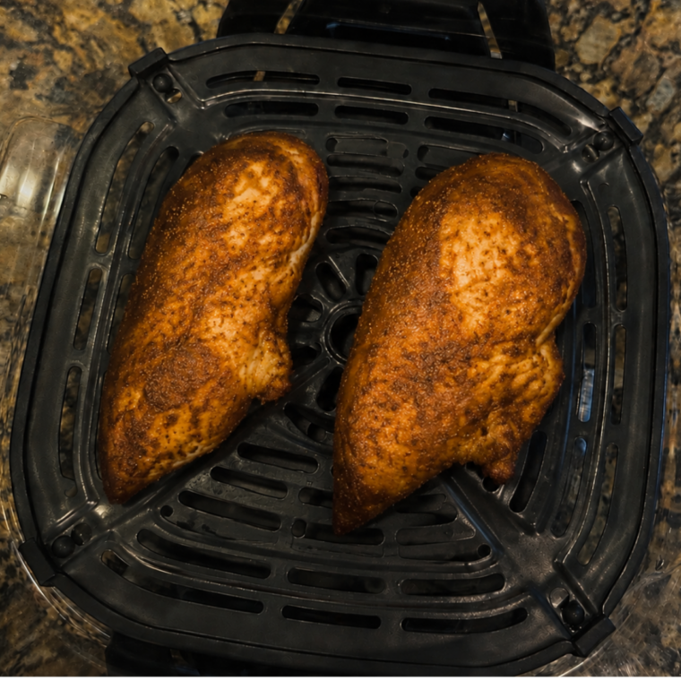 Instant-read thermometer showing 160°F in the thickest part of the turkey breast