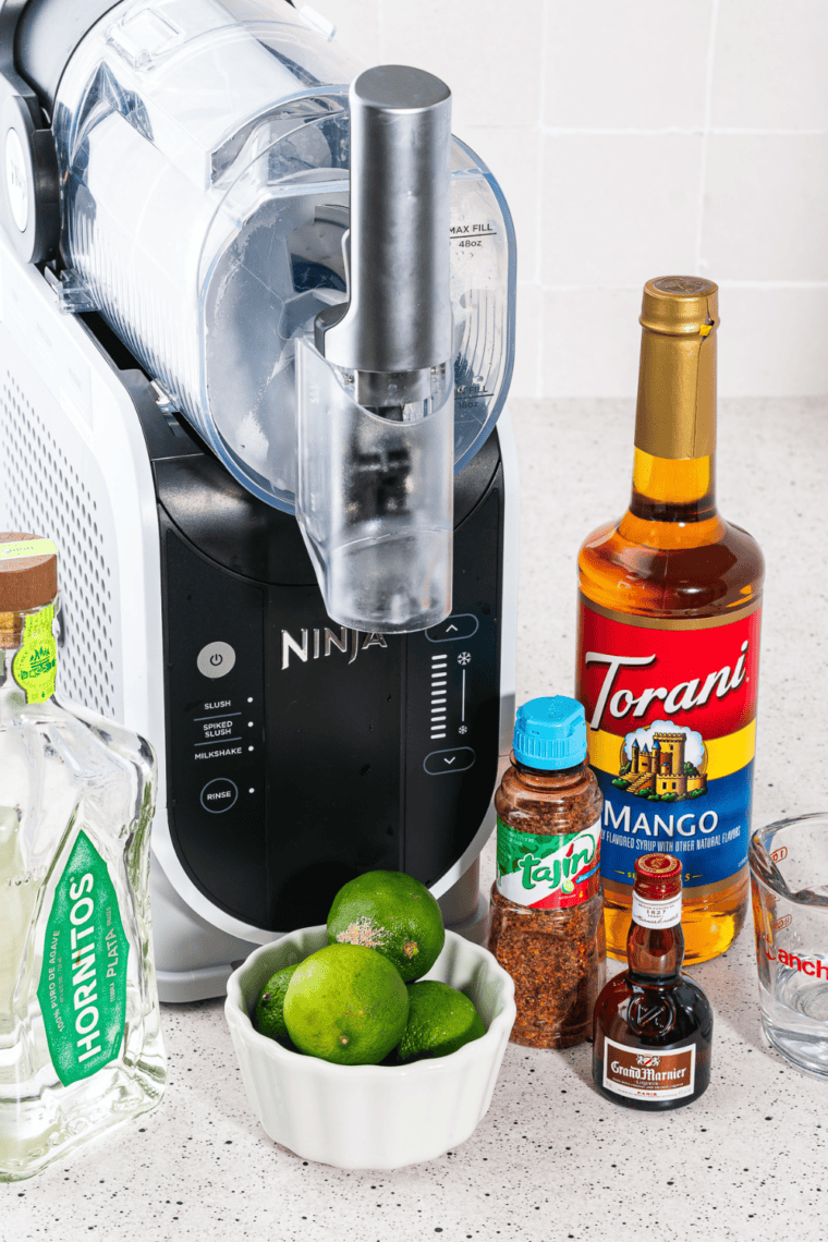 Margarita mixture poured into the Ninja Slushi vessel between the MIN and MAX fill lines