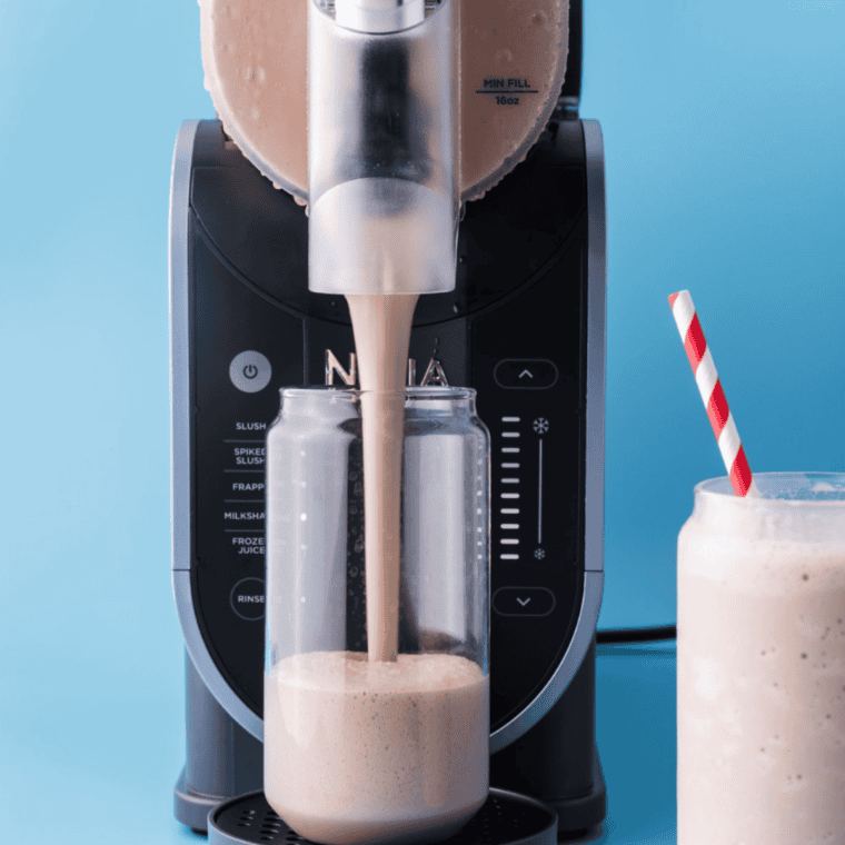 Milkshake base being poured through the Ninja Slushi fill port